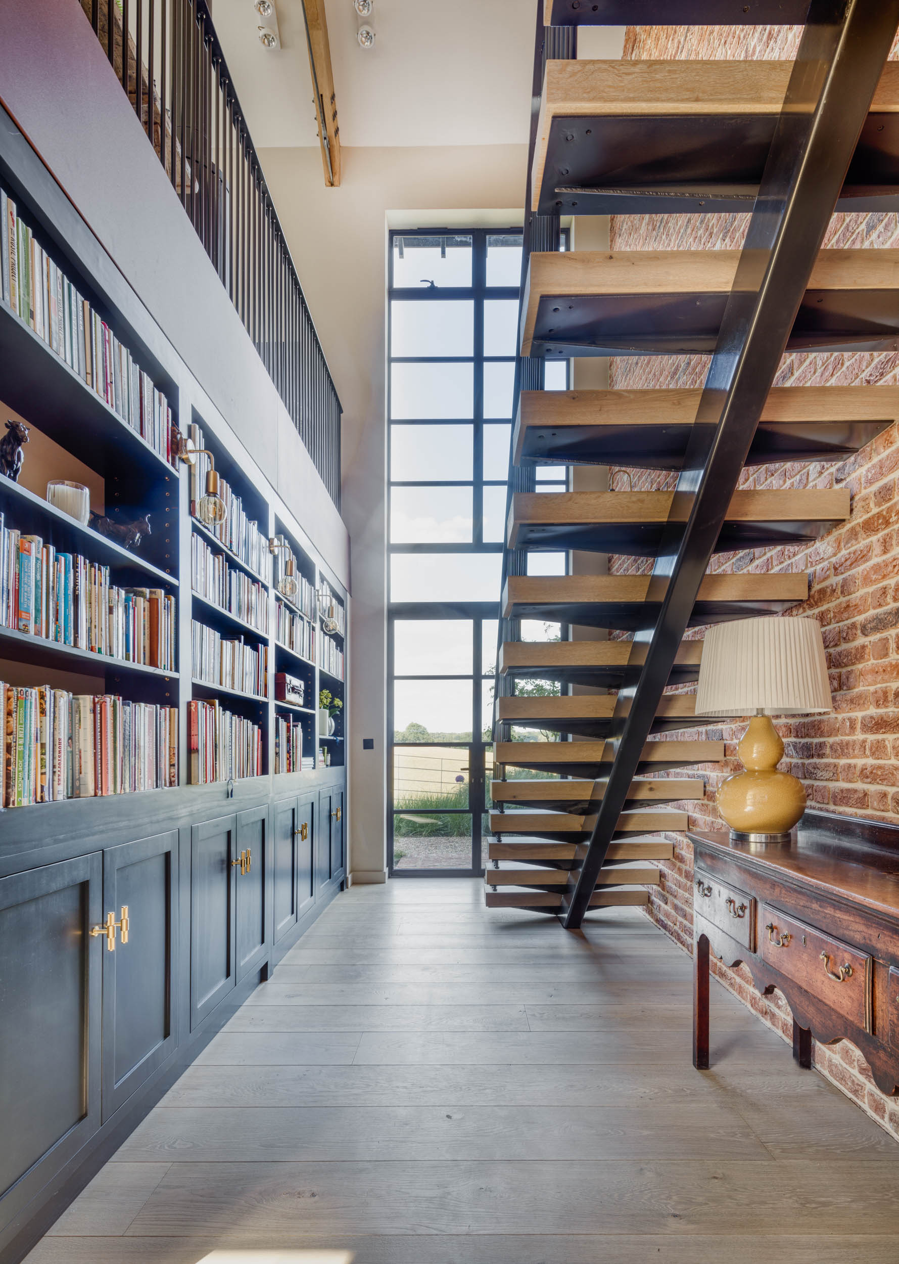 Double height home library interior designers buckinghamshire