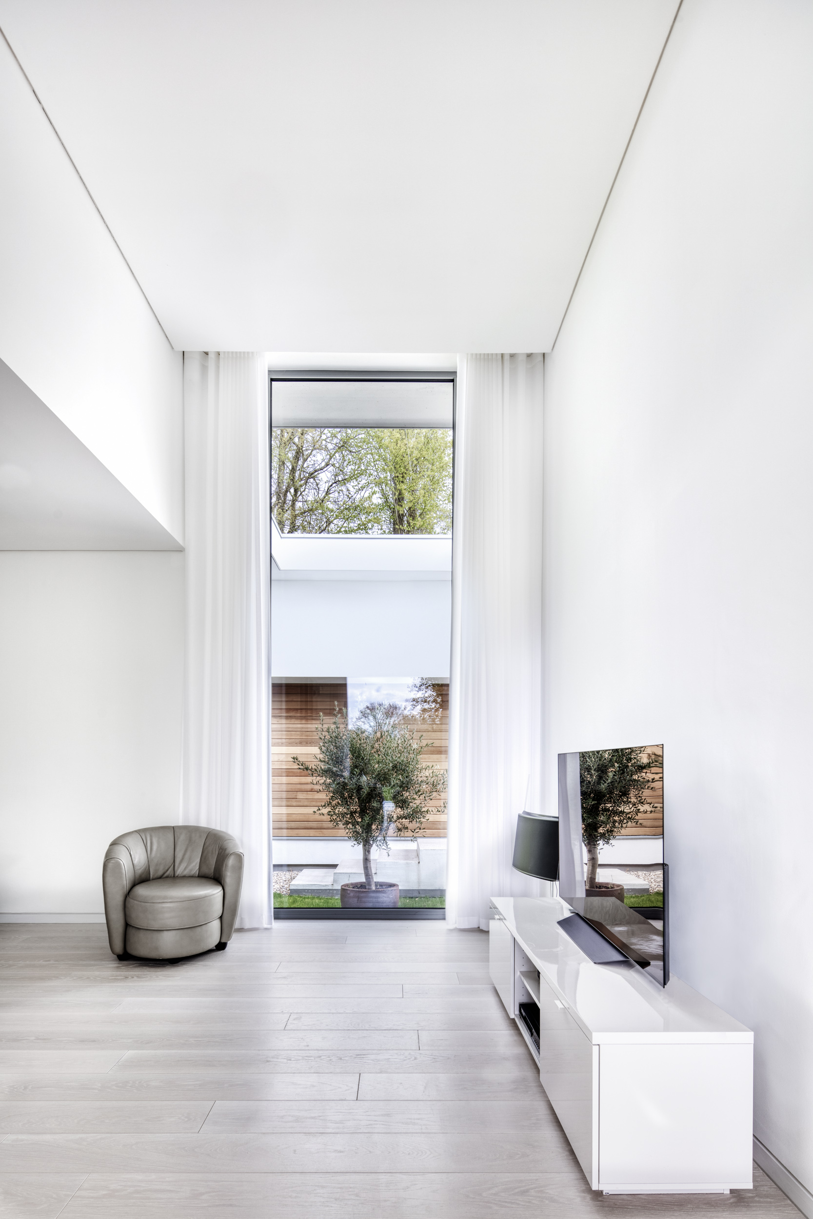 Floor to ceiling picture window modern new build home design