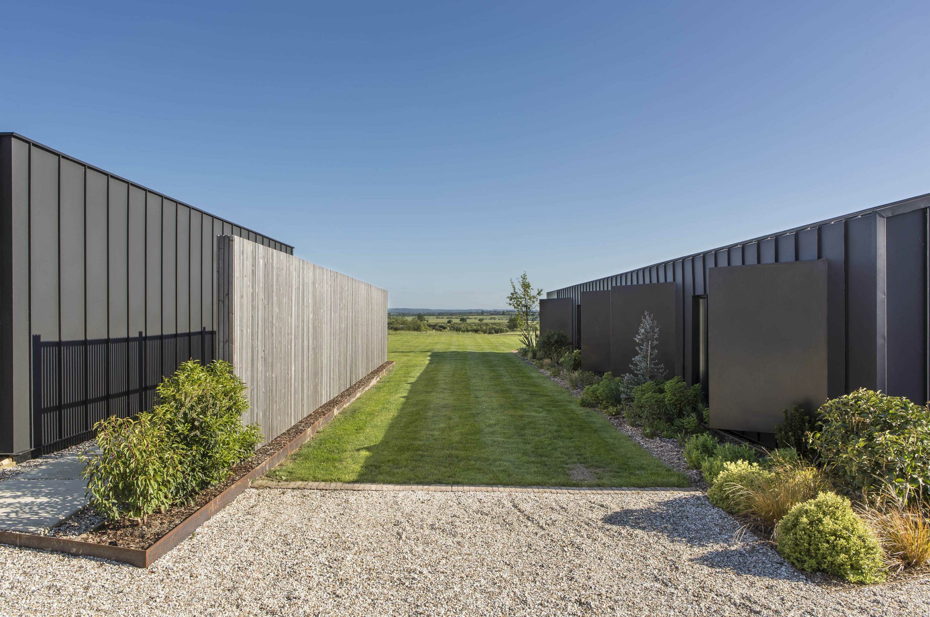 Two aluminium clad sustainable barn conversions in rural chilterns
