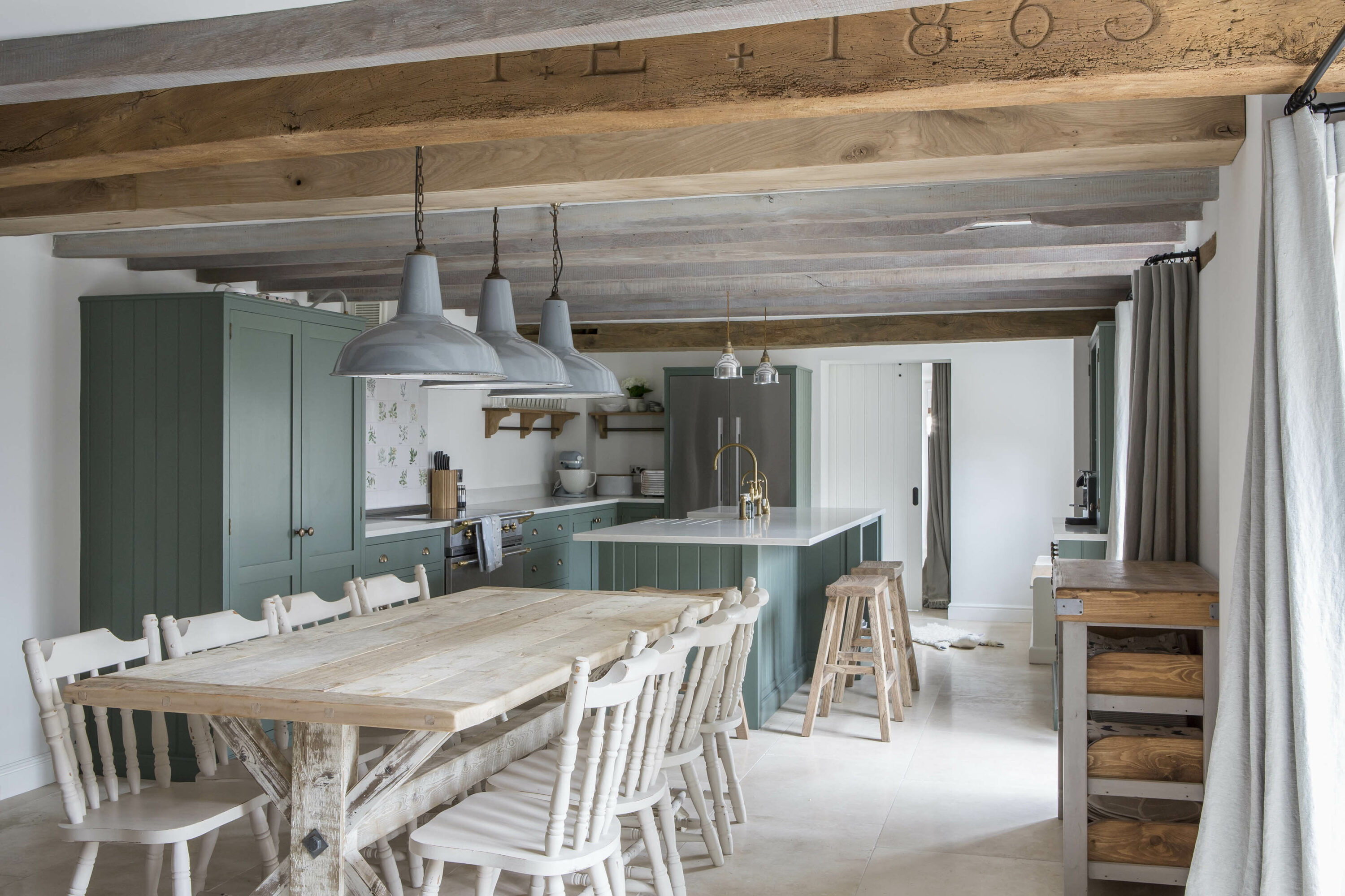 Beautiful cottage kitchen dining room with exposed beams