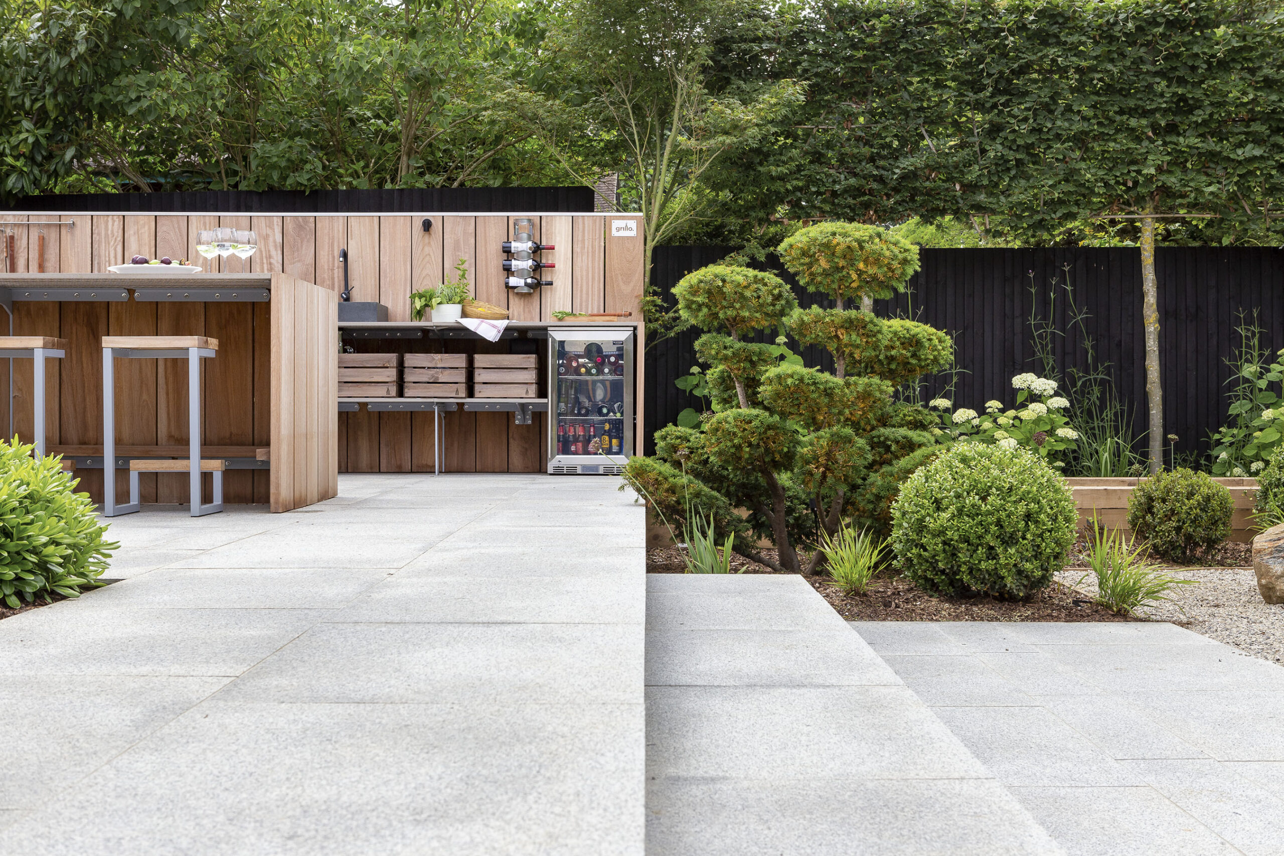 Luxury outdoor kitchen party garden with beautiful planting design