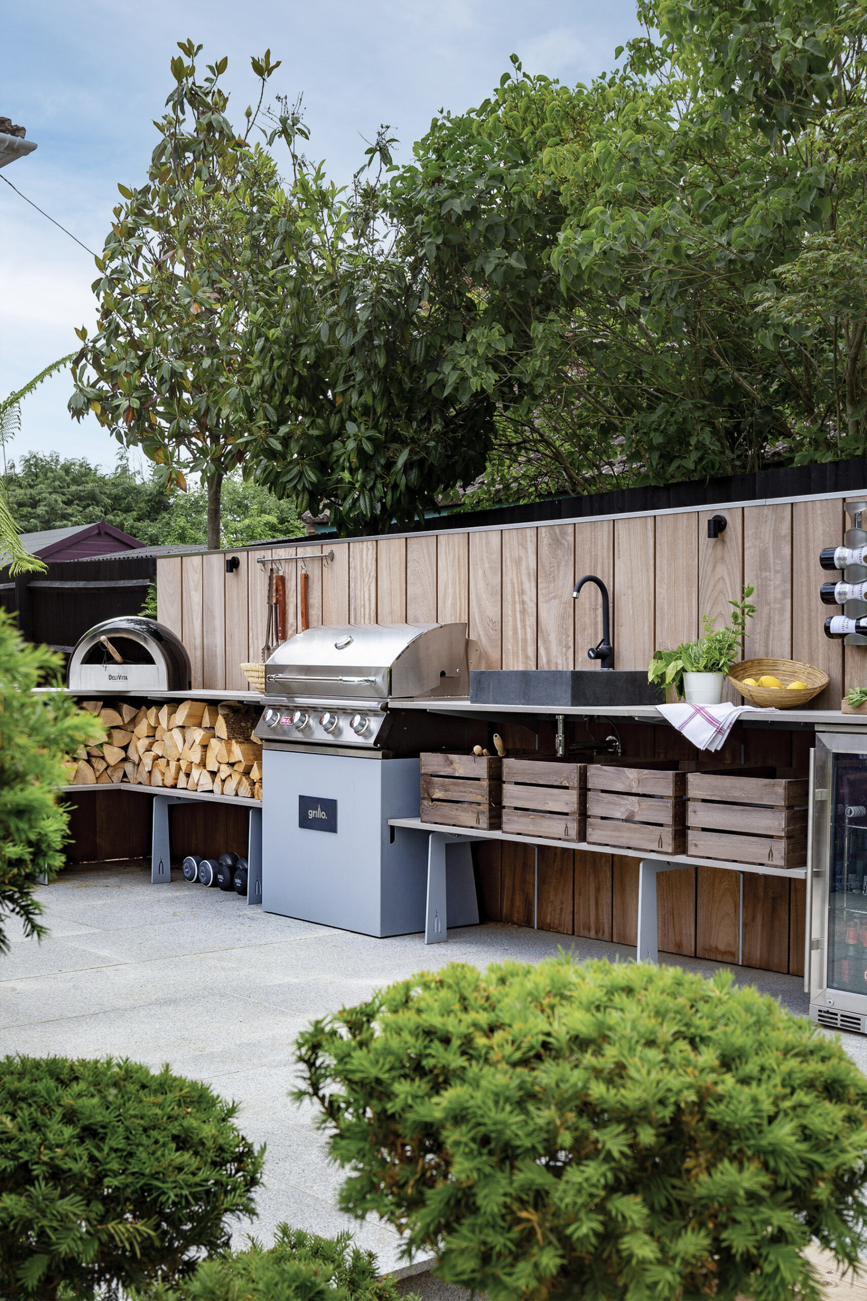 Luxury outdoor kitchen wood pizza oven and wine cooler