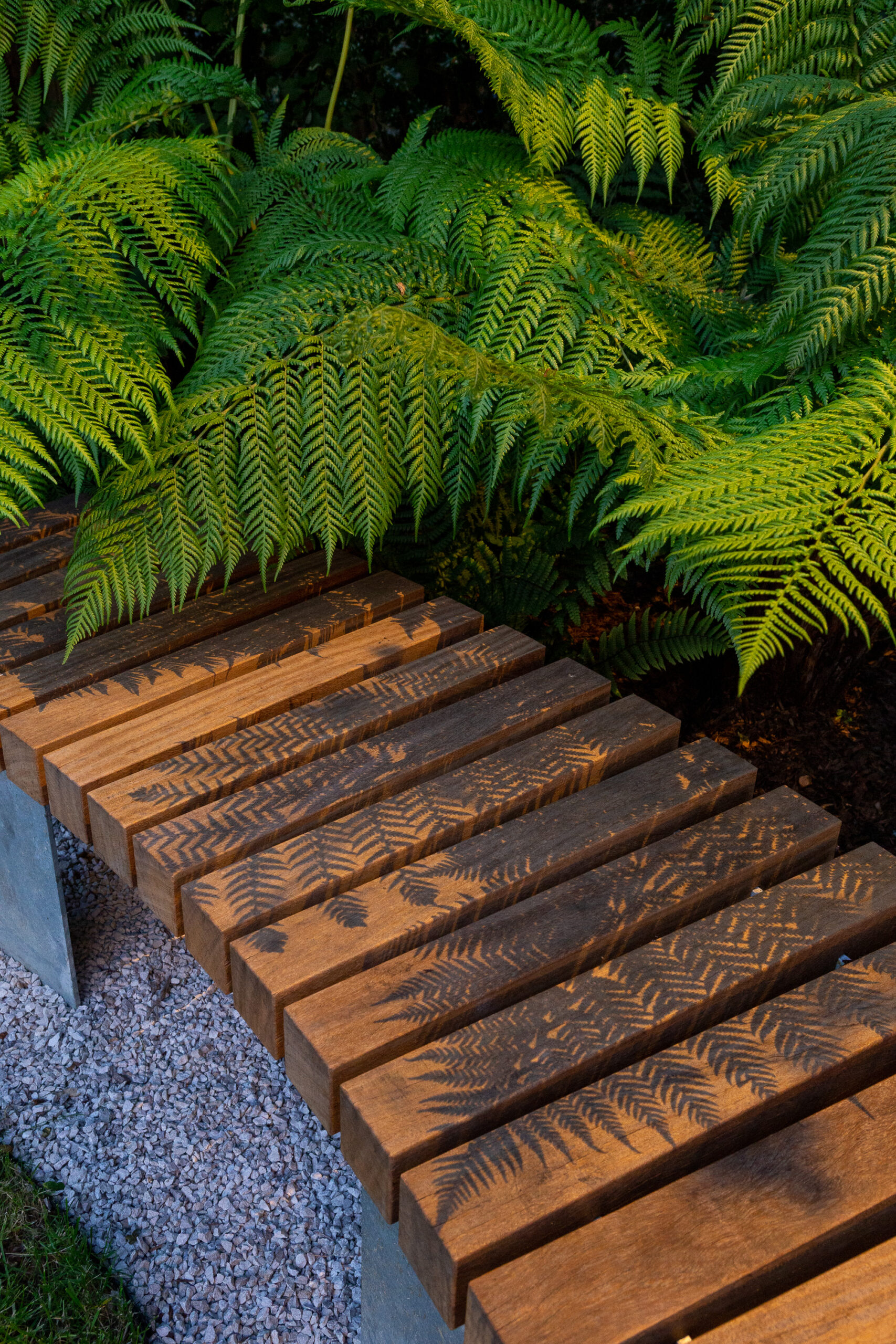 Timber garden bench tranquil garden design