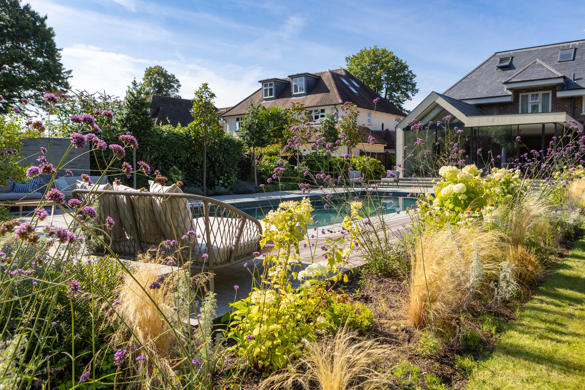 Beautiful timber sliding deck and cantilevered bench garden design