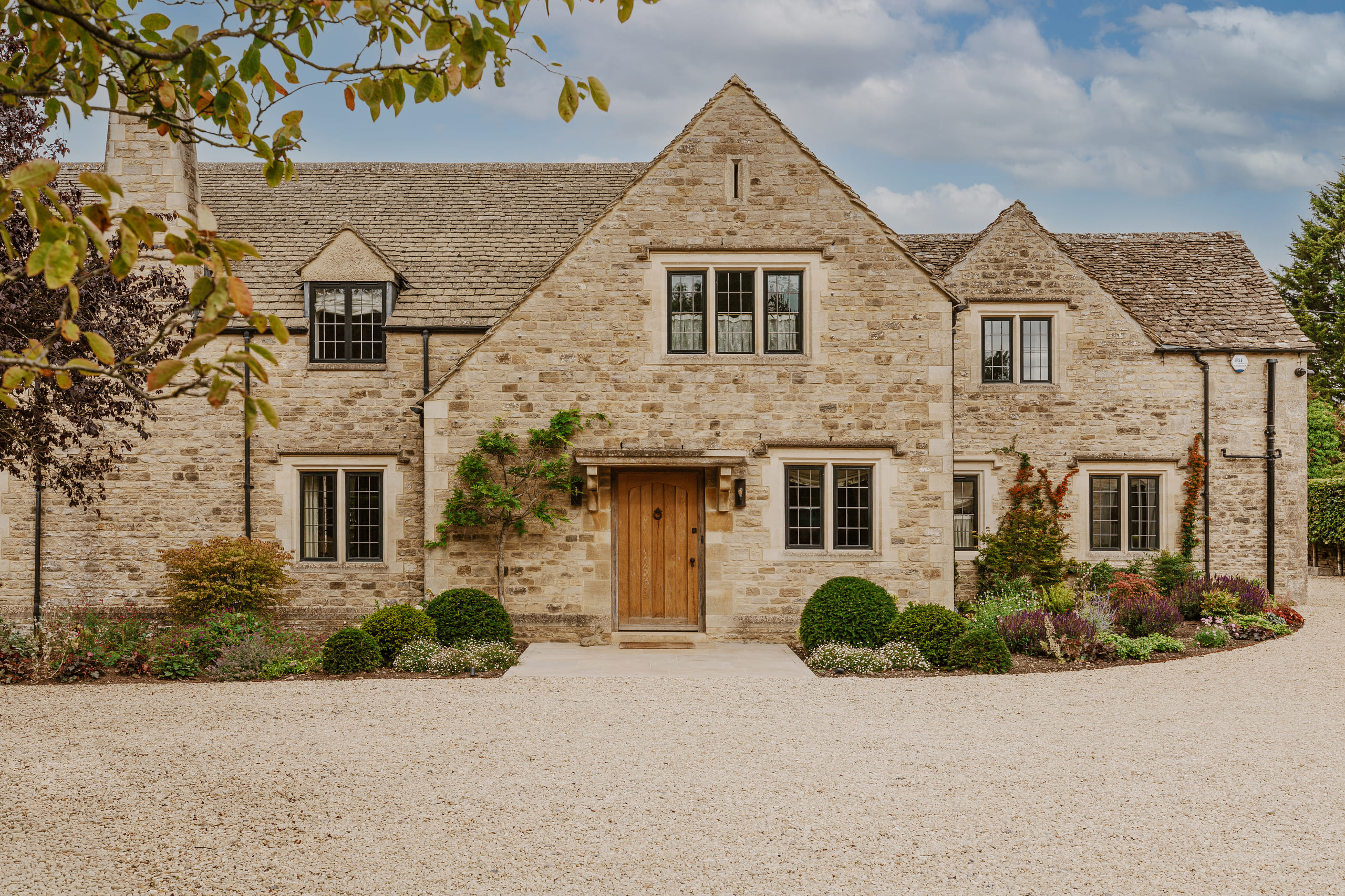 Traditional Cotswolds Stone Manor by HollandGreen