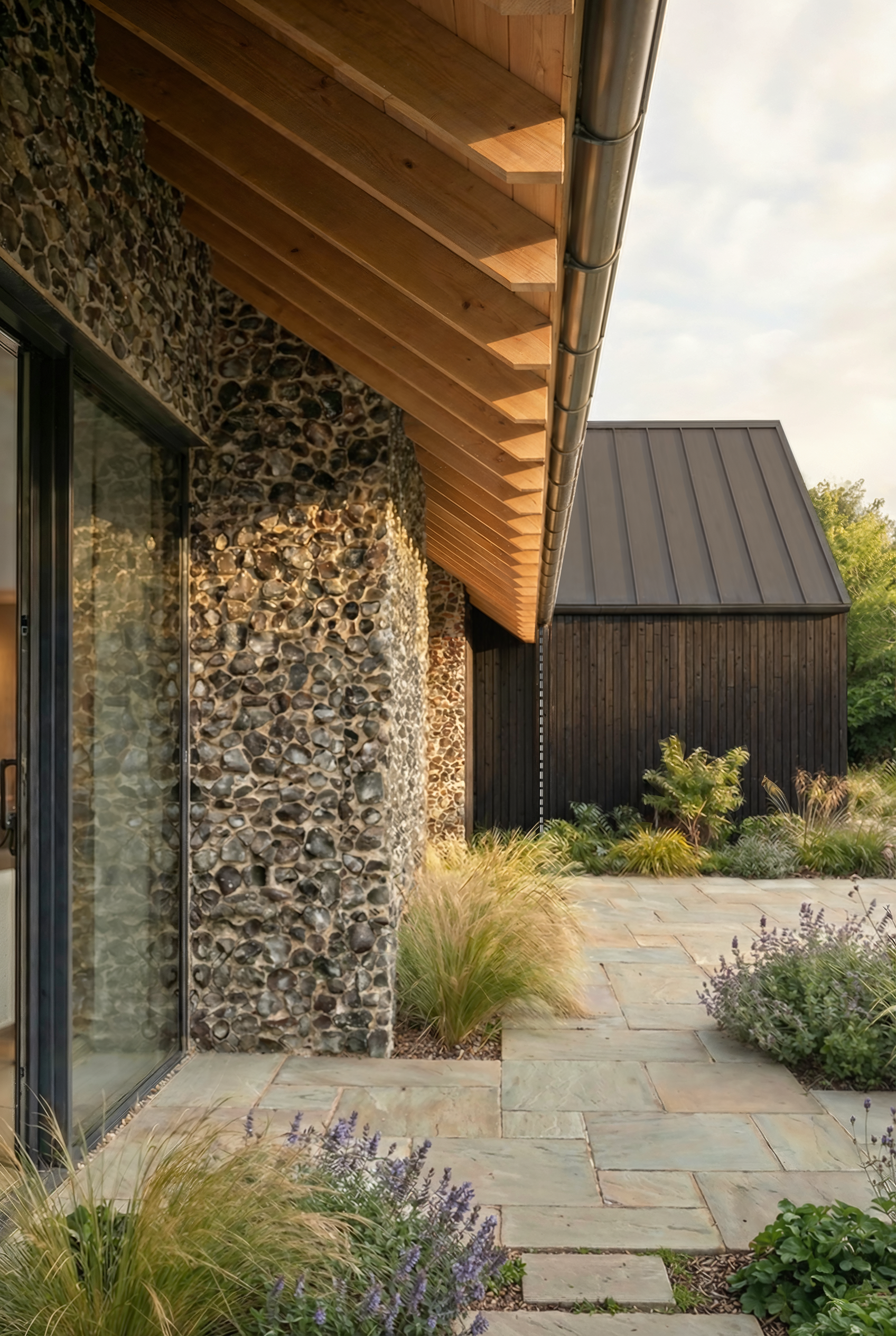 Oakfield | arge glazed apertures are strategically set back beneath deep, oversailing eaves.